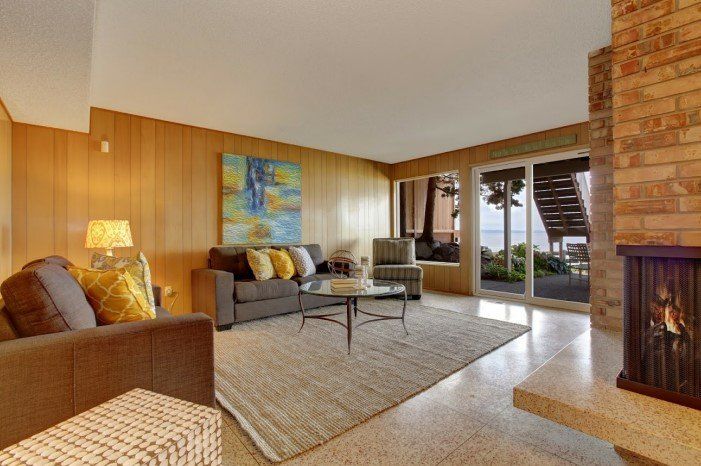 a living room filled with furniture and a fireplace